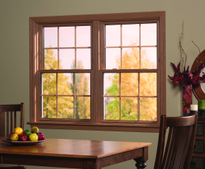 Light-grain, wood double-hung windows installed at a residential property.