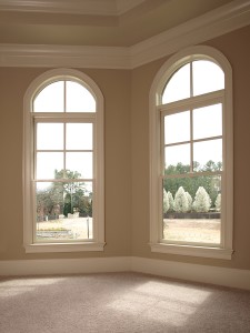 Large elegant home windows with view of outdoors.